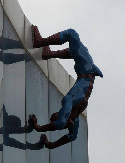 erect spiderman sculpture