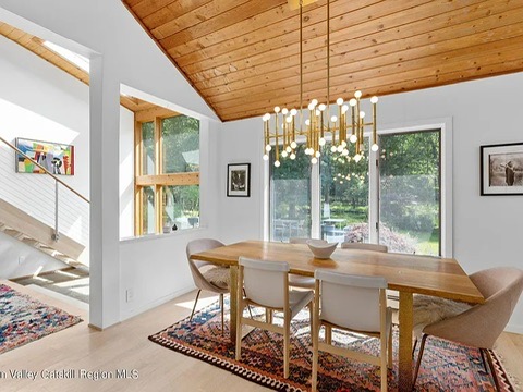 woodstock, ny retreat, giant vaulted ceilings with natural wood finish dining room