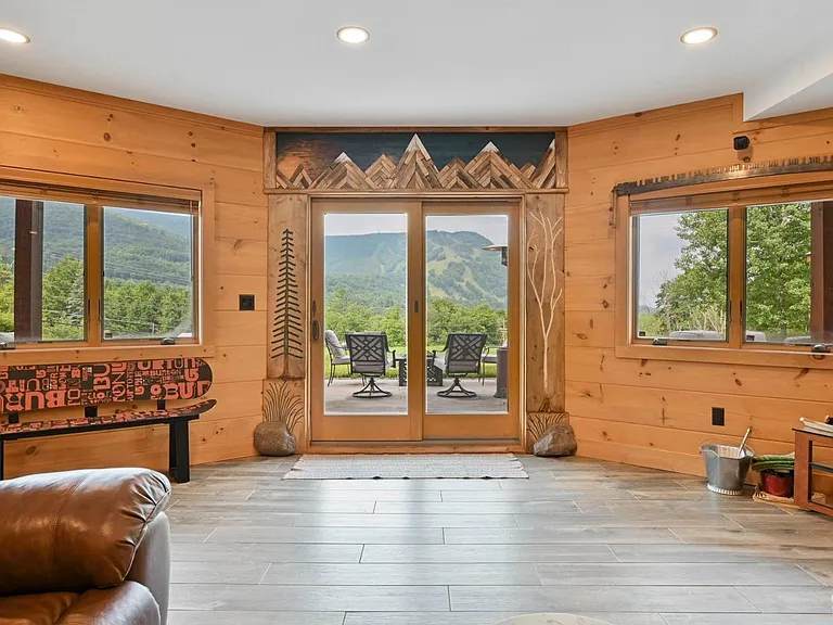 Hunter Mountain, NY ski chalet, natural wood home bar and entertainment room with wood burning stove