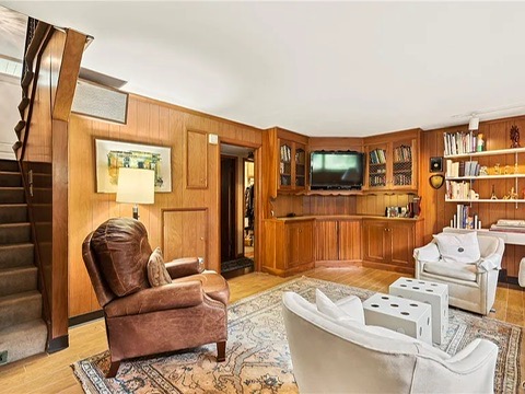 vintage MCM Fayetteville, NY house for sale with retro details, midcentury den with seating area and built-in bar