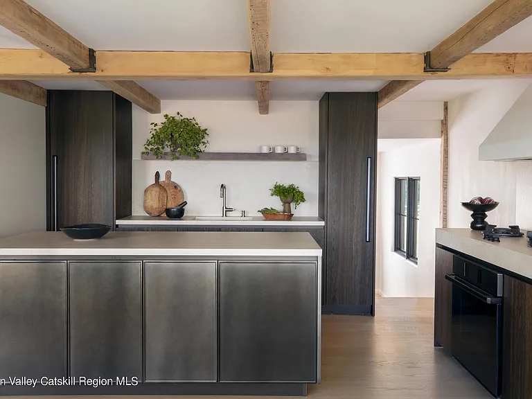 Highland, NY estate with neutral colors, neutral modern kitchen with black cabinets