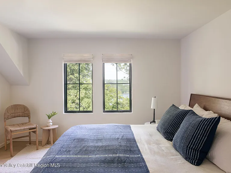 Highland, NY estate with neutral colors, neutral modern bedroom