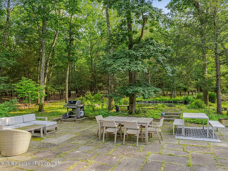 woodstock, ny retreat, backyard patio furniture under the forest canopy