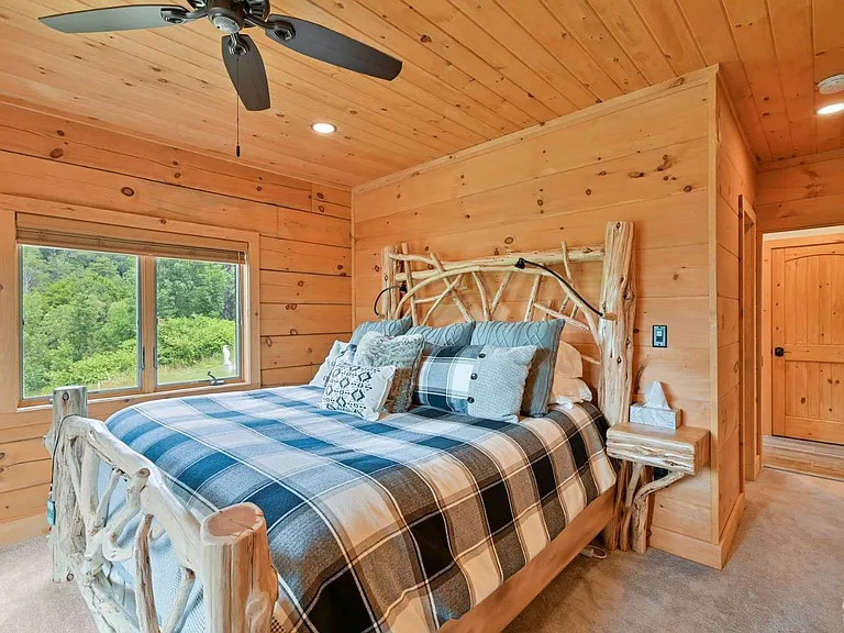 Hunter Mountain, NY ski chalet, log cabin bedroom with natural live edge wood bed