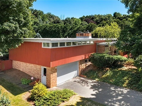 vintage MCM Fayetteville, NY house for sale with retro details, red wood exterior with flat roof