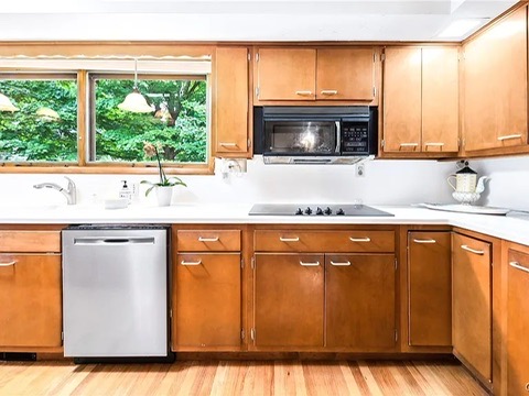 vintage MCM Fayetteville, NY house for sale with retro details, midcentury kitchen with cherrywood cabinets