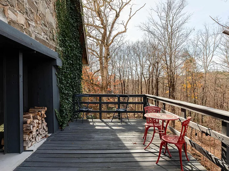 Ulster Park, NY Church turned residential home, exterior with charcoal deck and stacked firewood