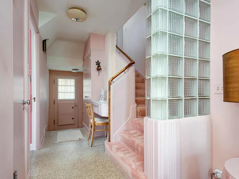 vintage Rock Island Illinois house, wall to wall pink carpet in the foyer with glass tile walls