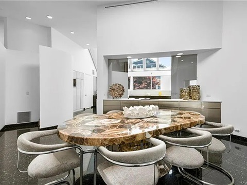 New Rochelle beach house in New York, vintage dining area with chrome chairs