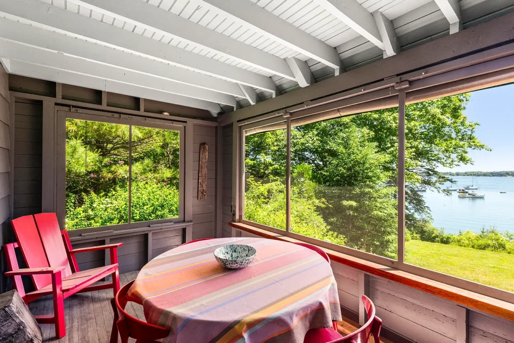 Rustic Maine Beach House, exposed natural wood beams in a vintage dining room