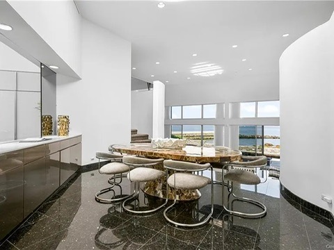 New Rochelle beach house in New York, vintage dining area with chrome chairs