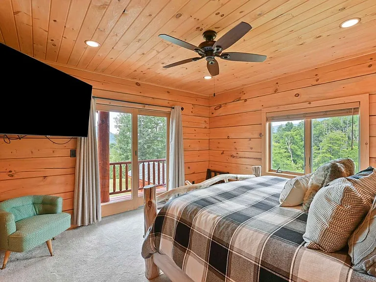 Hunter Mountain, NY ski chalet, log cabin bedroom with natural live edge wood bed