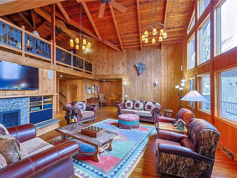 Living room with vaulted ceilings at 295 Co Road 2A, Olivebridge, NY 12461, Rustic Catskills Cabin Estate