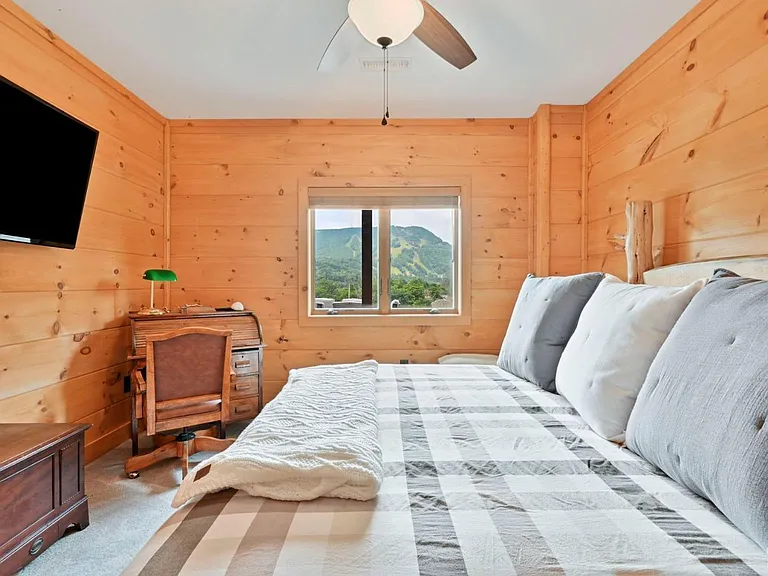 Hunter Mountain, NY ski chalet, log cabin bedroom with natural live edge wood bed