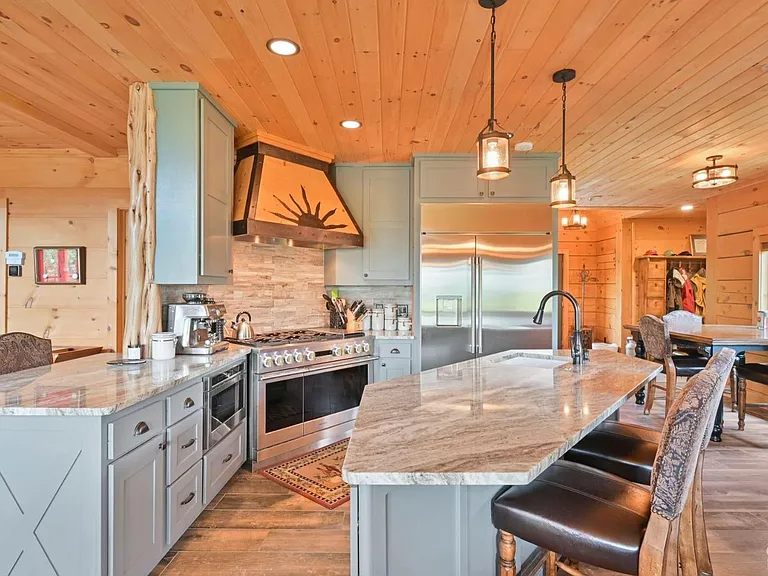 Hunter Mountain, NY ski chalet, log cabin kitchen with gray cabinets and granite countertops