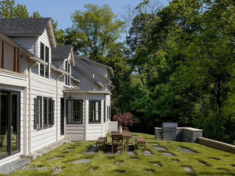 Highland, NY estate with neutral colors, original white shingle exterior