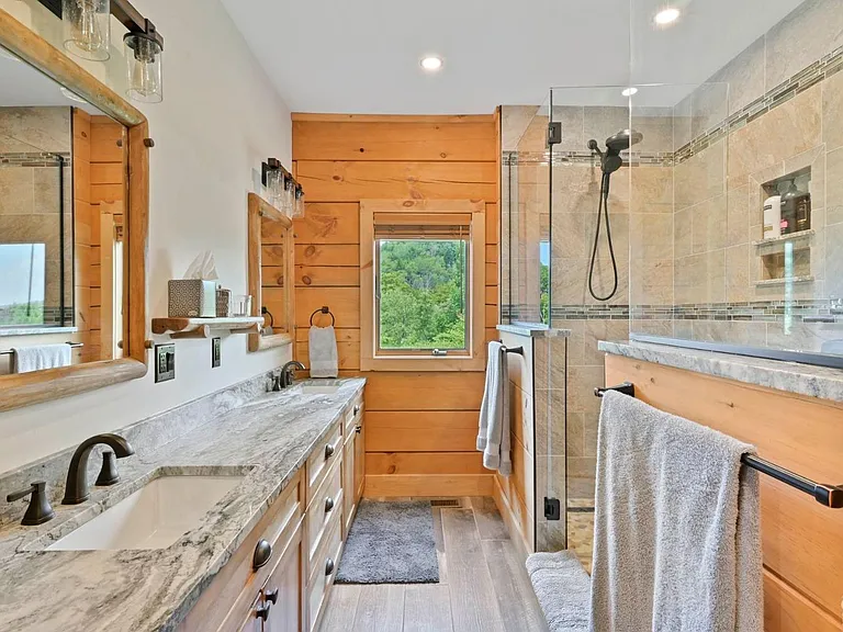 Hunter Mountain, NY ski chalet, log cabin bathroom with local granite vanity and live edge wood cabinetry