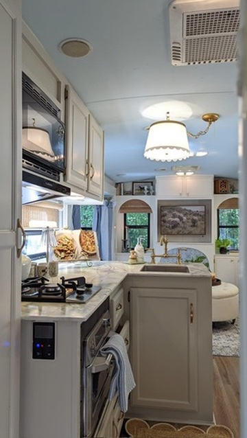 renovated camper, french countryside and southern belle design with an updated white kitchen