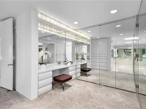 New Rochelle beach house in New York, vintage master bedroom with massive tile soaking tub and glass shower