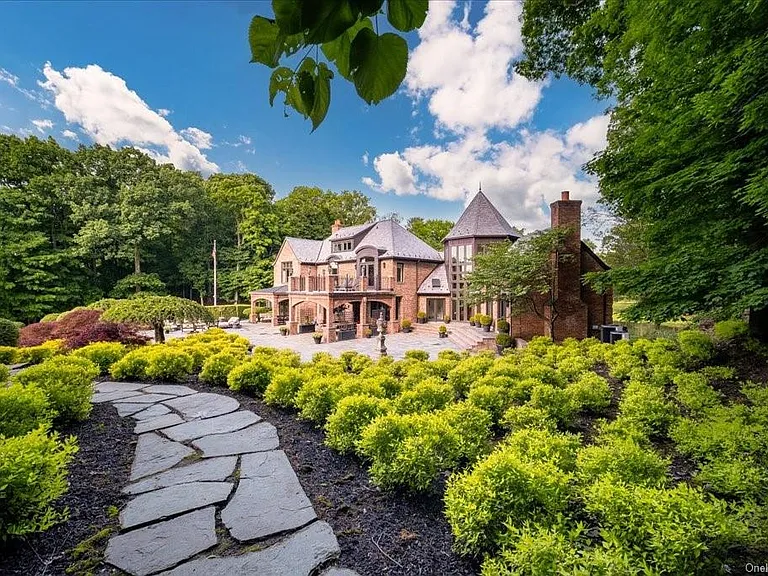 Wappingers Falls NY mansion compound overlooking the Hudson River, bluestone walking path leading to brick exterior