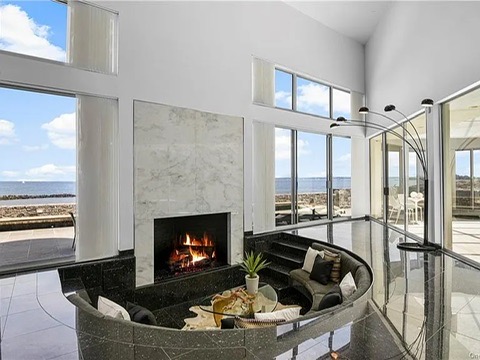 New Rochelle beach house in New York, sunken tile conversation pit and fireplace overlooking the Long Island Sound