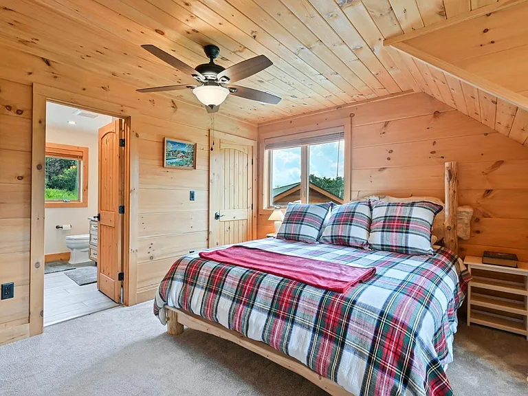 Hunter Mountain, NY ski chalet, log cabin bedroom with natural live edge wood bed