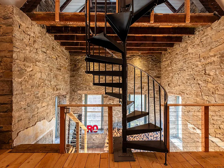 Ulster Park, NY Church reimagined as a residential property and art studio. winding black metal staircase