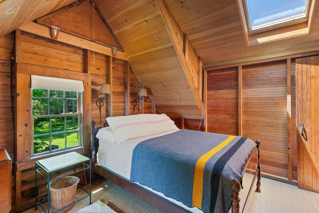 Rustic Maine Beach House, exposed natural wood bedroom facing the atlantic ocean