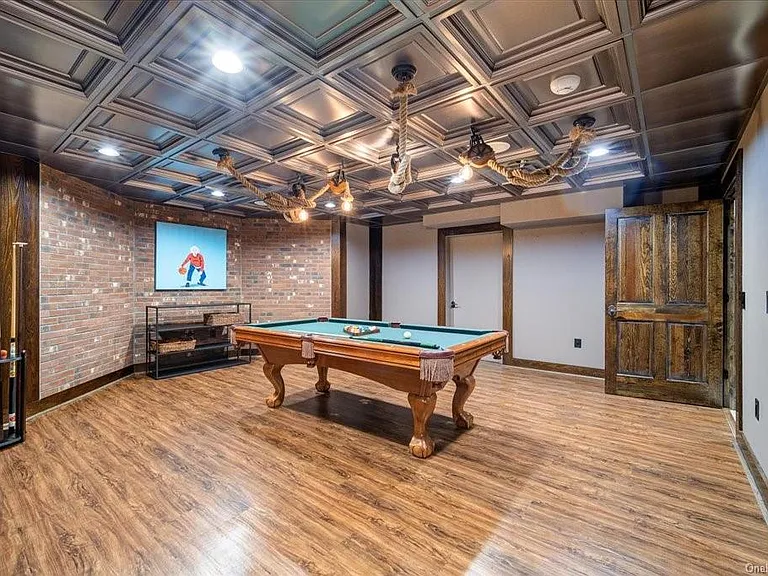 Wappingers Falls NY mansion compound overlooking the Hudson River, basement pool hall and game room with wood detailing