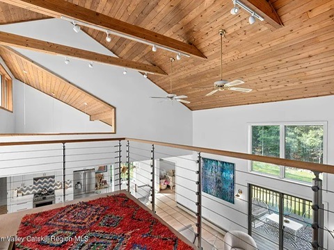 Woodstock NY retreat, soaring 25-foot ceilings finished with natural wood