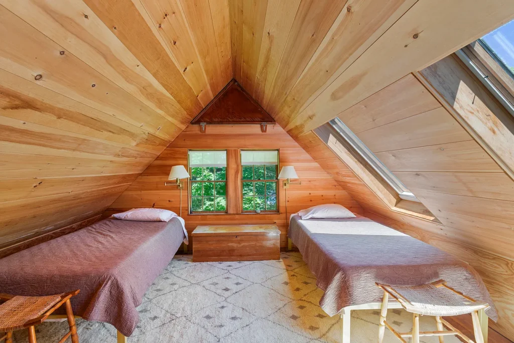 Rustic Maine Beach House, exposed natural wood bedroom facing the atlantic ocean