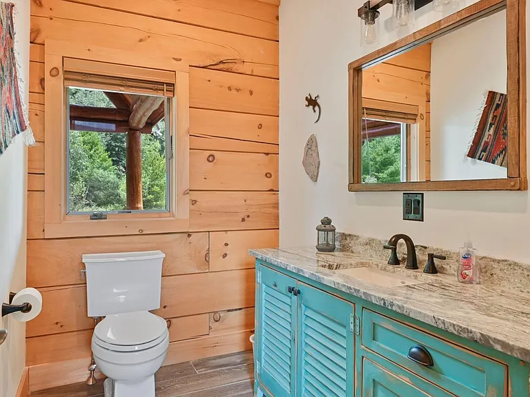 Hunter Mountain, NY ski chalet, log cabin bathroom with local granite vanity and live edge wood cabinetry