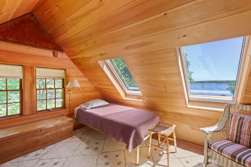 Rustic Maine Beach House, exposed natural wood bedroom facing the atlantic ocean