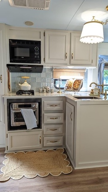 renovated camper, french countryside and southern belle design with an updated white kitchen