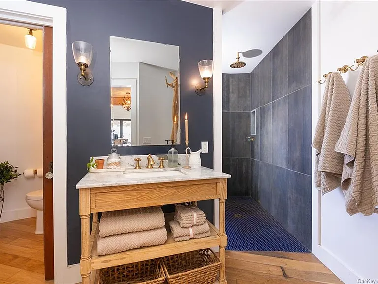 hudson valley yurt house, renovated yurt bathroom with spanish tile and a soaking tub