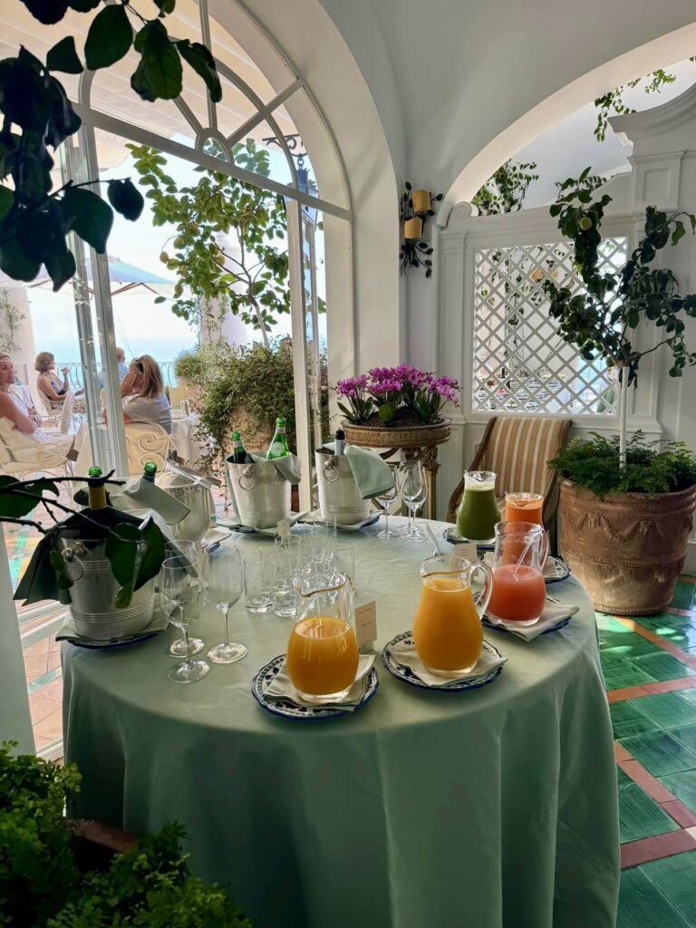 positano beach, hotel breakfast buffet with fresh italian fruits and juice