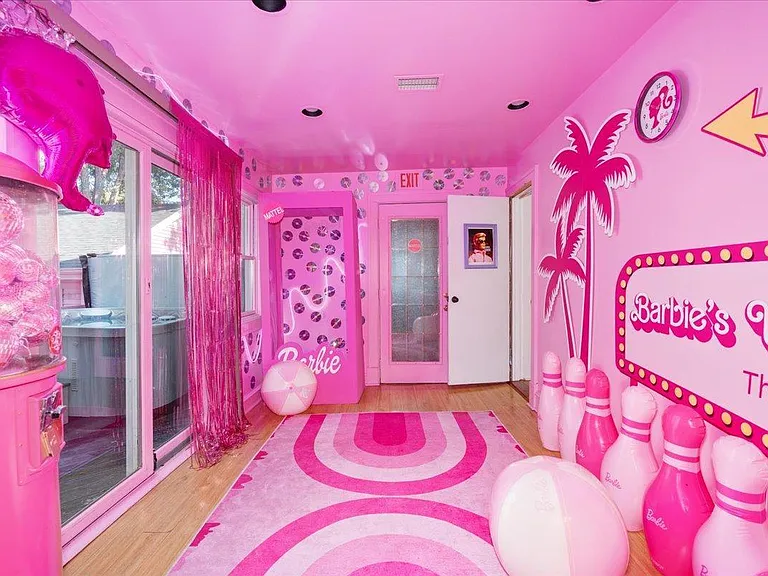 all-pink Barbie Dream House for sale, all pink living room with pink sofas and rugs