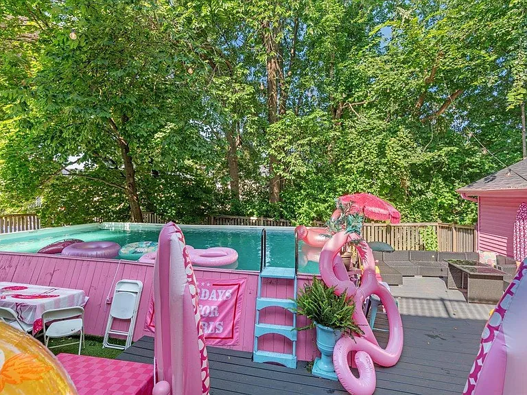 all-pink Barbie Dream House for sale, pink backyard pool perfect for a real life barbie