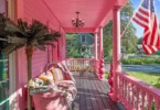 all-pink Barbie Dream House for sale, all pink wraparound porch with pink outdoor sofa