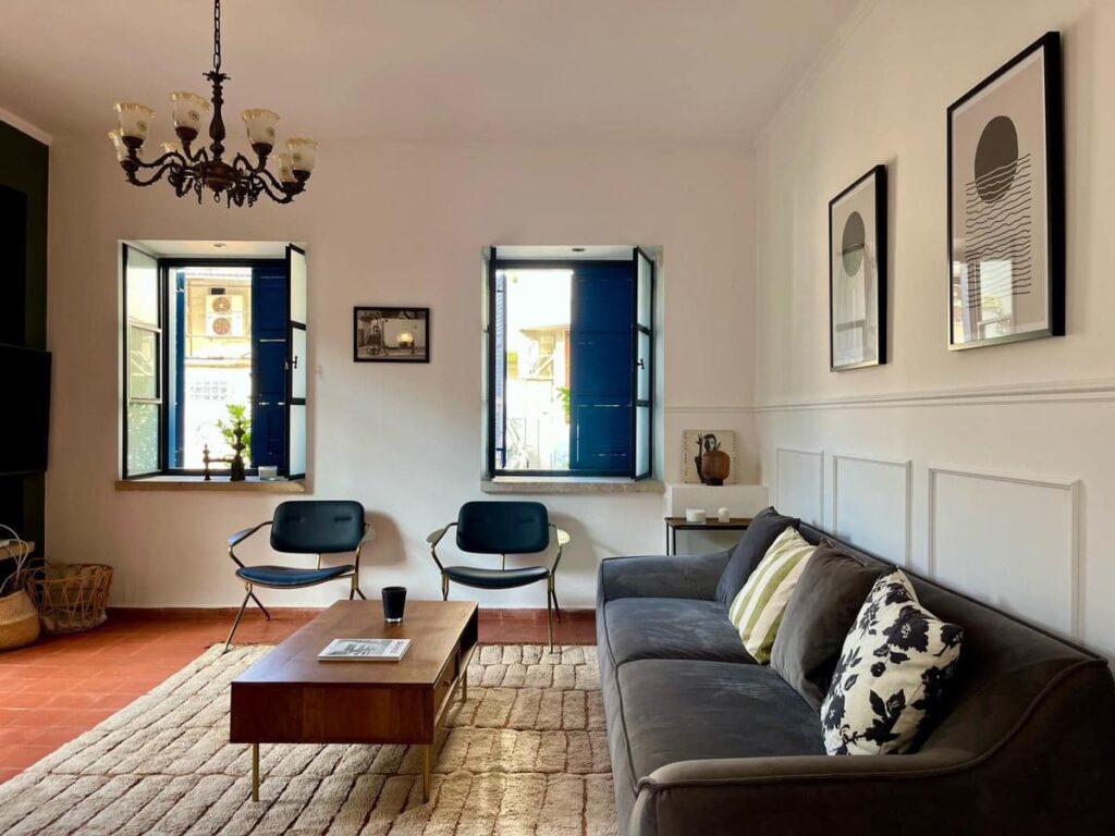 light bright rooms, living room seating flanked by vintage windows and light fixtures