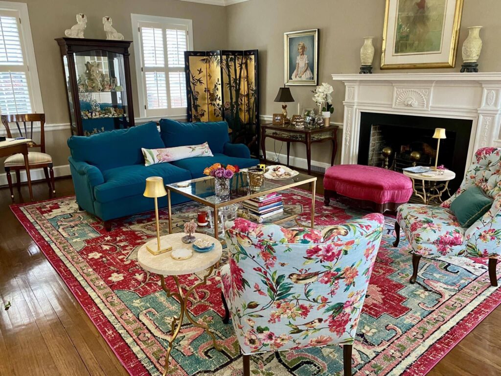 light bright rooms, navy and red sofas in an eclectic floral living room