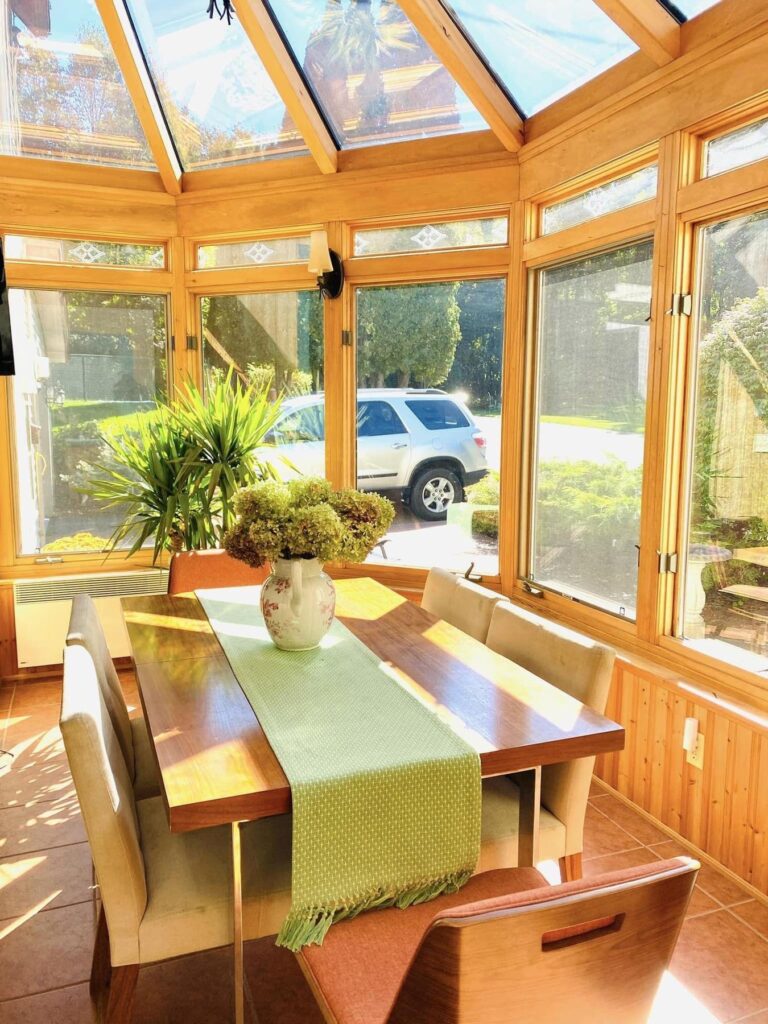 light bright rooms, sun filled enclosed porch with all natural wood detailing