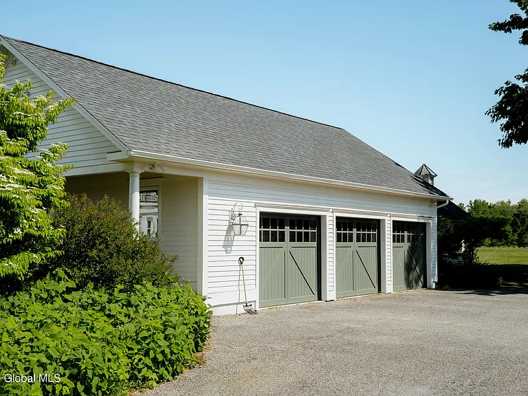 Valatie NY Equestrian Estate, three car garage with sage green doors