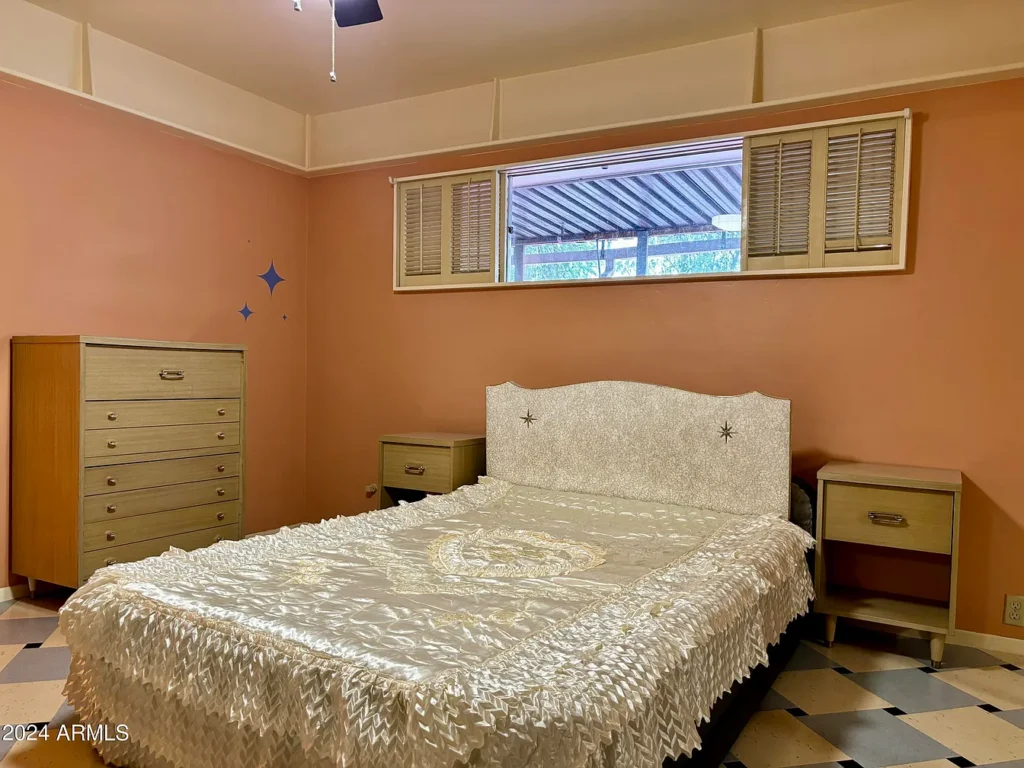 1950s suburban family life home, phoenix arizona 1957 ranch style home with high master bedroom windows and lace coverlets