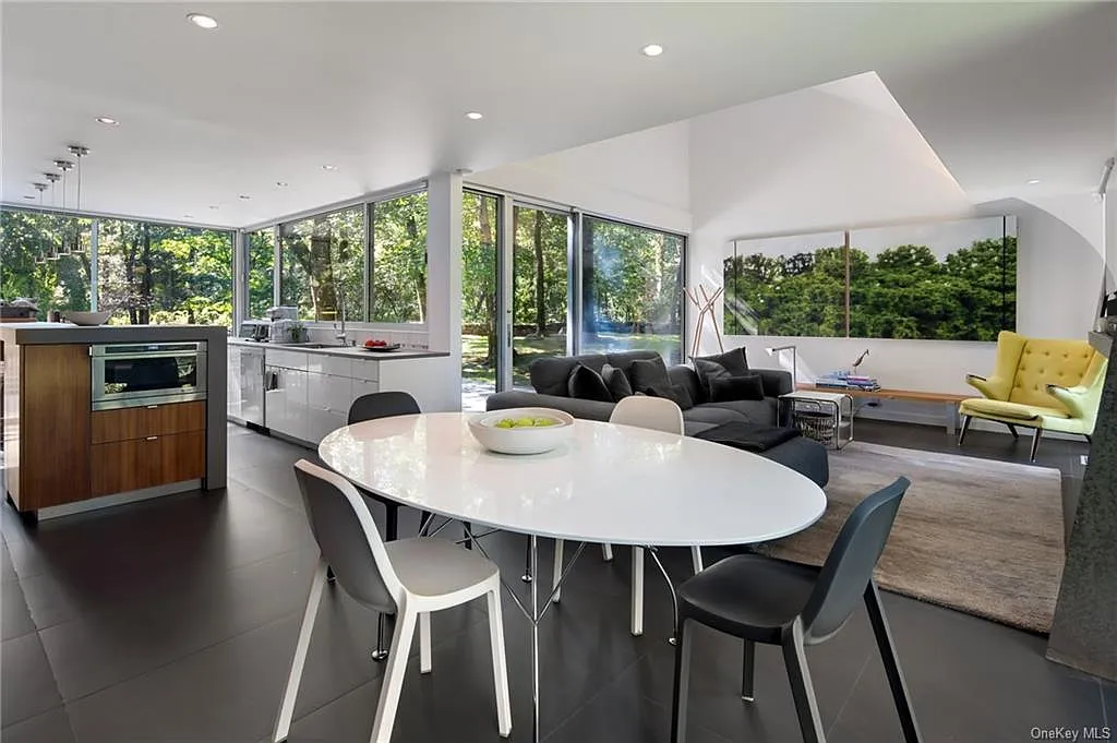 modern chappaqua, ny house, modern interior design with industrial kitchen and modern dining room with vaulted ceilings