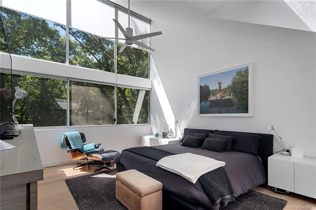 modern chappaqua, ny house, modern interior design master bedroom with vaulted ceilings and skylights