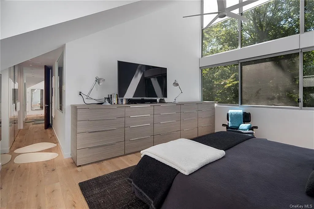 modern chappaqua, ny house, modern interior design master bedroom with vaulted ceilings and skylights