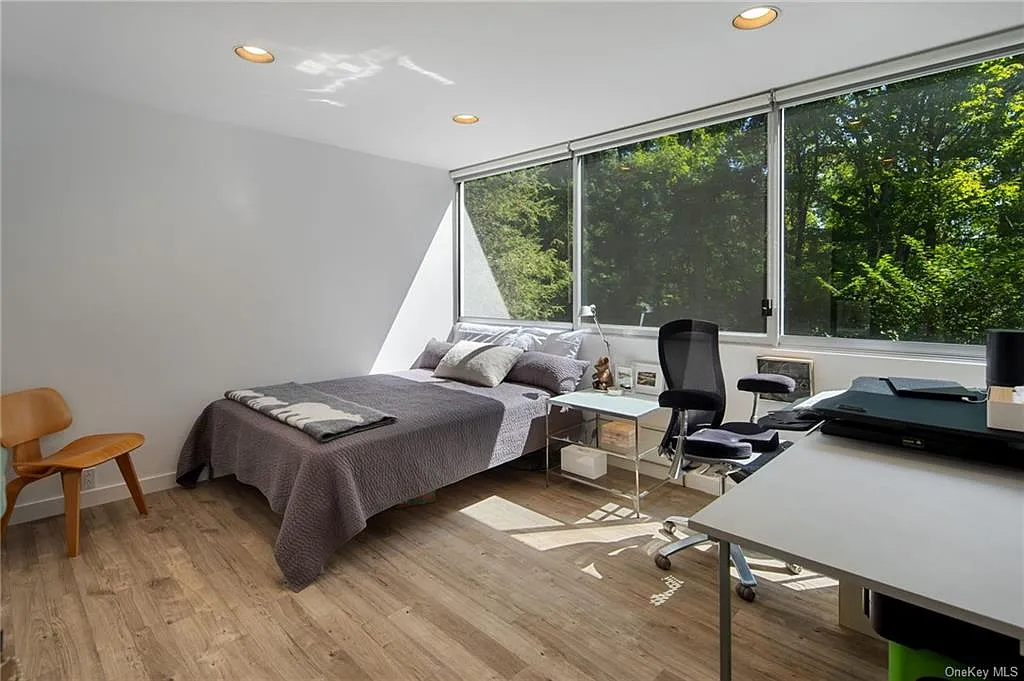 modern chappaqua, ny house, modern interior design guest bedroom with vaulted ceilings and skylights