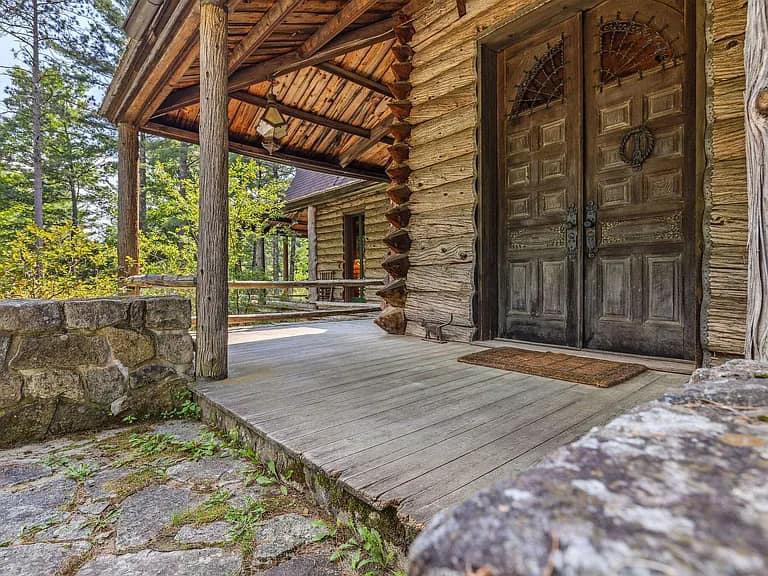 Keene Valley NY house with wood walls and ceilings and log cabin exterior and wrap around log porch