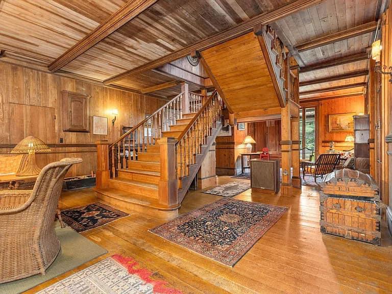 Keene Valley NY house with wood walls and impressive all wood staircase